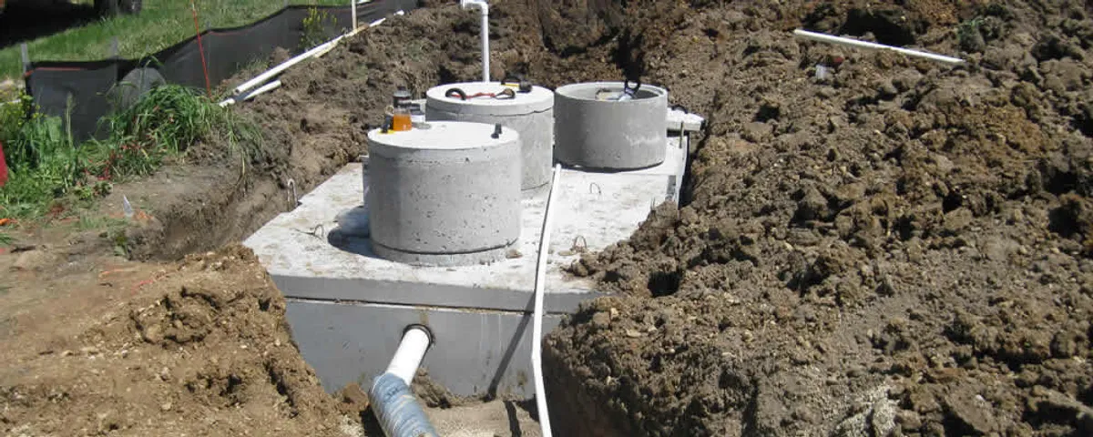 Septic system repair and installation site with tank access ports in Fort Collins, CO
